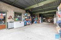 Open bebouwing mét ruime loods op perceel van 40 are ! 6