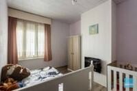 Degelijke rijwoning met 3 slpks, tuin, loods en autostaanplaatsen. 13