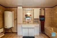 Degelijke rijwoning met 3 slpks, tuin, loods en autostaanplaatsen. 8